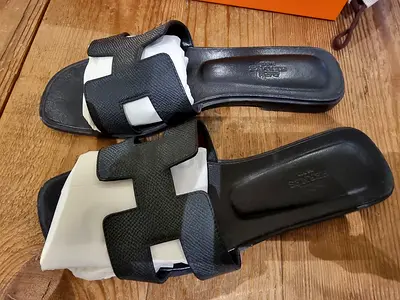 Used black Hermes-slip-on sandals, size UK 37.5