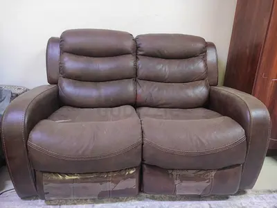 Brown leather single-seater recliner armchair - good condition