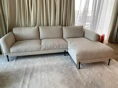In excellent condition the loom collection feather filled lshape sofa