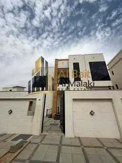 Al Bait Al Malaki Real Estate presents a villa for sale in Al Helio 2, Ajman on two streets at below