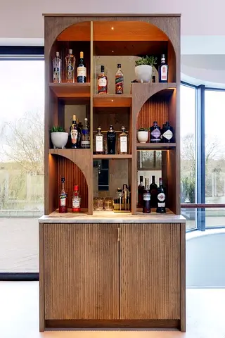 Modern Wooden Bar Cabinet with Arched Shelving and Integrated Lighting