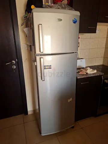 Silver double-door refrigerator (top freezer), used, good condition
