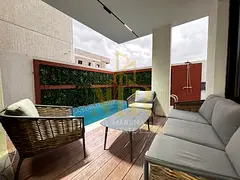 A luxurious two-story villa with a rooftop terrace and swimming pool in Al Bahia. Modern design and