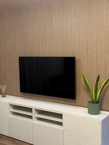 Slim wall-mounted LED TV with setup