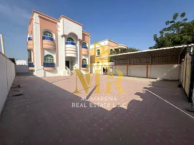 Villa for sale in Ajman, Al Rawda. Electricity, water, and air conditioning included. 5 master bedrooms, majlis, living room, and maid's room. Freehol