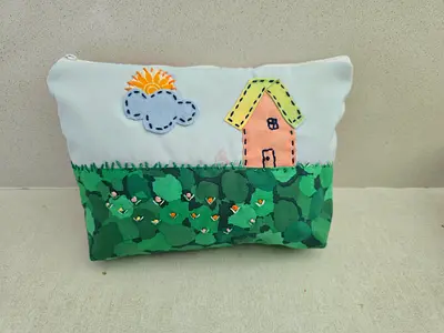 Handmade zippered pouch with house and garden embroidery