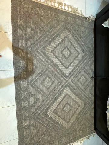 Used grey geometric flatweave rug with fringe, good condition 220x120