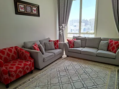 Red patterned upholstered sofa – good condition