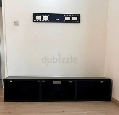 Low black TV cabinet / media console - 3 open compartments- good condition