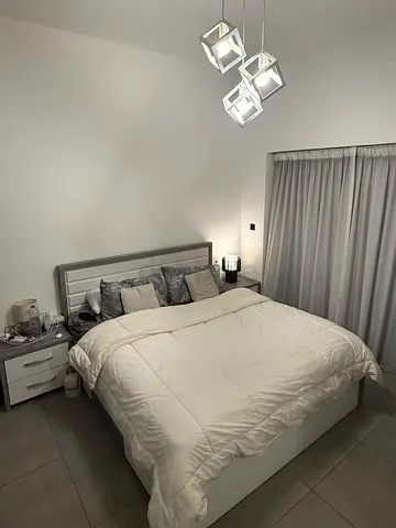 King bed with headboard and two bedside tables -1 table with mirror - 1 closet good condition