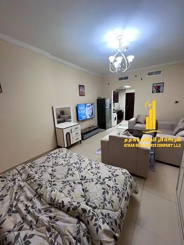 A fully furnished luxury studio apartment with brand new, high-end furniture in a prime location, including all bills, internet, and a private parking