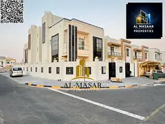Corner villa in Al Zahia, Ajman, two floors and a roof, central air conditioning, freehold ownership