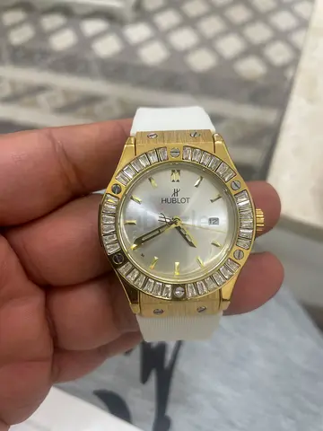 Hublot-style wristwatch with white strap and crystal bezel