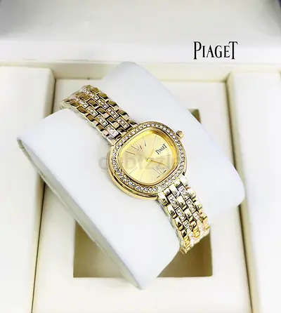 Piaget gold-tone womens watch with crystal bezel — elegant pre-owned piece