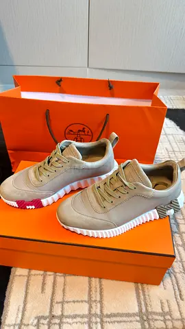 Light beige designer sneakers with white ridged sole — barely worn