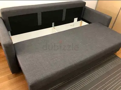 Grey fabric sofa bed with storage - good condition