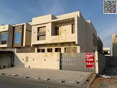 Villa for sale in Al Bahia, with a majlis and living room, prime location, and price includes fees.