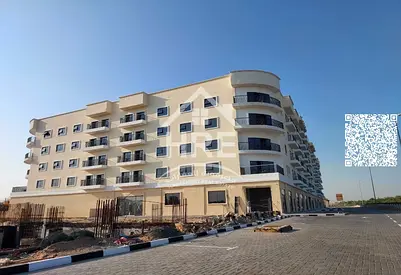 One-bedroom apartment with a living room and an open view in Al Zahia