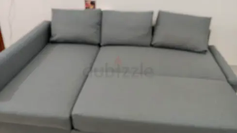 Grey L-shaped Sofa Bed with Cushions - Good Condition