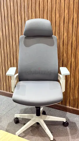 Grey ergonomic office chair with headrest — good condition
