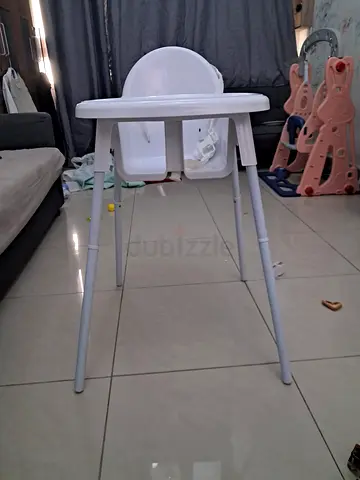 Simple white baby high chair — sturdy metal legs, good condition