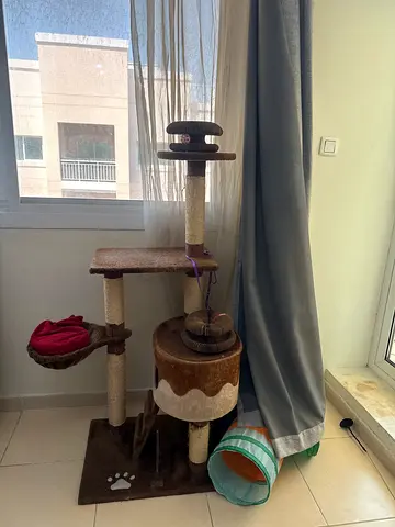 Used multi-level cat tree with scratching posts and cozy hideouts