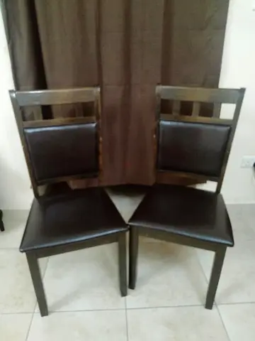 Set of 2 dark wood dining chairs with faux leather seats