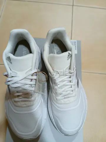 White Adidas running shoes - lightly used, size info on tag