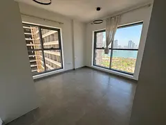 2-bedroom apartment with a beautiful sea view in Al Majaz 2, featuring built-in wardrobes, comfortab