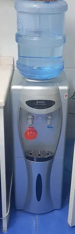 Silver freestanding water dispenser with hot and cold taps