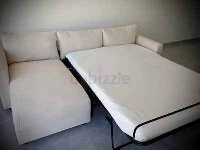 Beige color three seater sofabed from IKEA