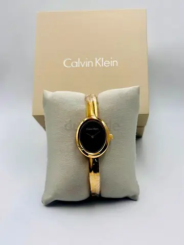 Calvin Klein womens gold-tone bangle watch, elegant black dial