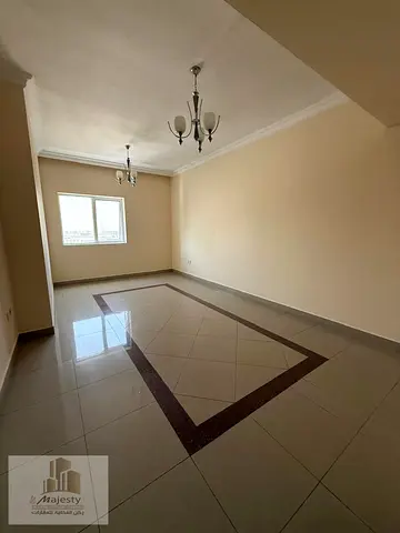 For sale: a 3-bedroom apartment with a living room and a maid's room in the Emirate of Sharjah, Al Taawun area