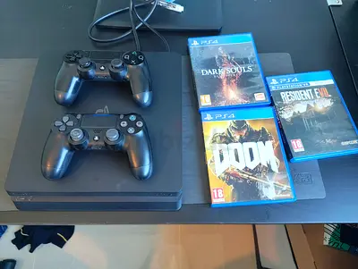 PS4 Slim with 2 Controllers + 3 Games (Doom, Dark Souls, Resident Evil 7)