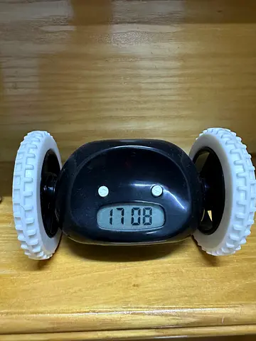 Small digital clock alarm with wheel display - used