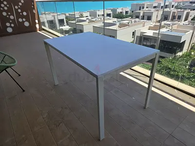 Simple White Indoor Dining Table or Desk - Good Condition with a small tear on one corner