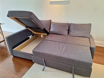 Gray L-shaped Sofa Bed with Storage - Good Condition