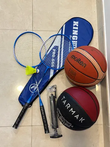 Sports Equipment Collection including Basketballs and Badminton Set