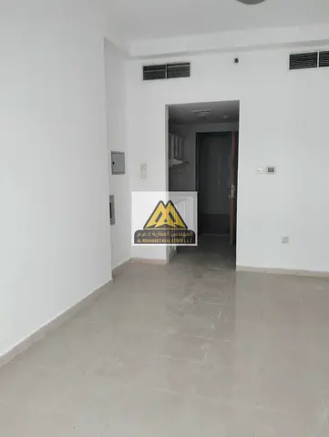 A spacious studio apartment available for annual rent in Pearl Towers, Al Rashidiya 1, Ajman