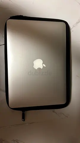 Silver Apple MacBook Pro 13” with Protective Sleeve