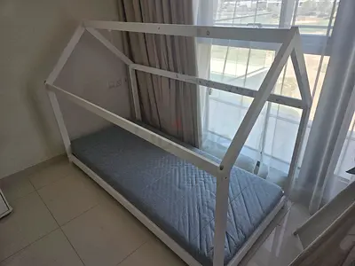 Home Box White Montessori Style House Bed Frame for Kids 200×90 complete with his Ikea mattress.