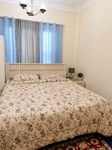 Queen bed frame with mattress and bedside table - light wood