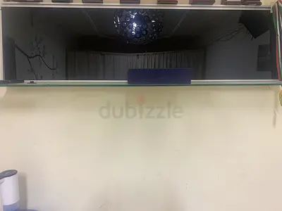 Wall mounted glass shelf