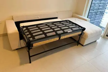 White L-shaped Sofa with Pull-out Guest Bed - Good Condition