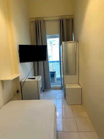 Available single partition with balcony and smart tv and fridge in sports city