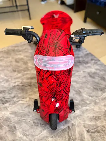 Red Spider Web Ride-On Scooter for Kids - Good Condition