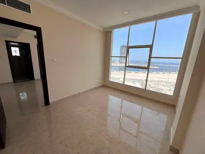 One-bedroom apartment for annual rent in Ajman Corniche with a direct panoramic sea view - AED 33,000
