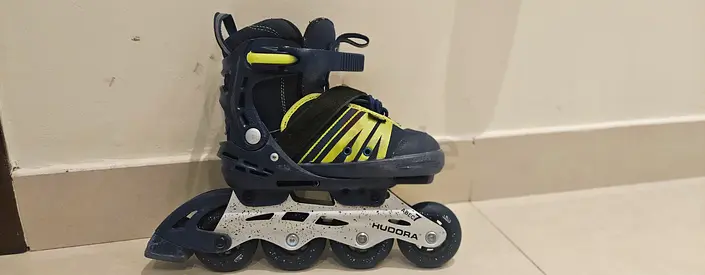 Hudora adjustable lnline skates , blue /green , excellent condition,  smooth ride , lightly used .