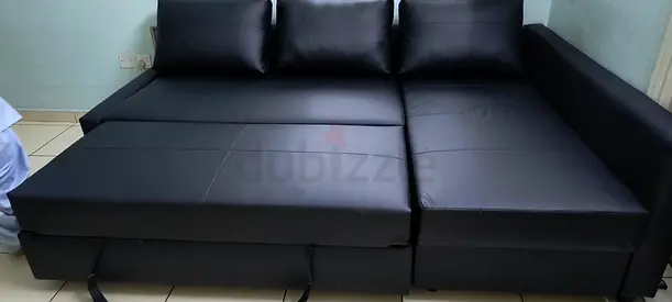 Black L-shaped Sofa Bed with Storage - Good Condition