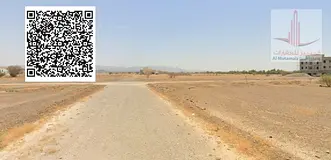 A plot of land in Masfout, Basin 8, corner lot on two streets and a railway, very large area and exc
